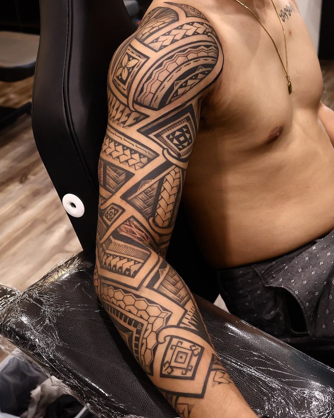 Filipino tribal forearm band with sun and rice motifs in Toronto