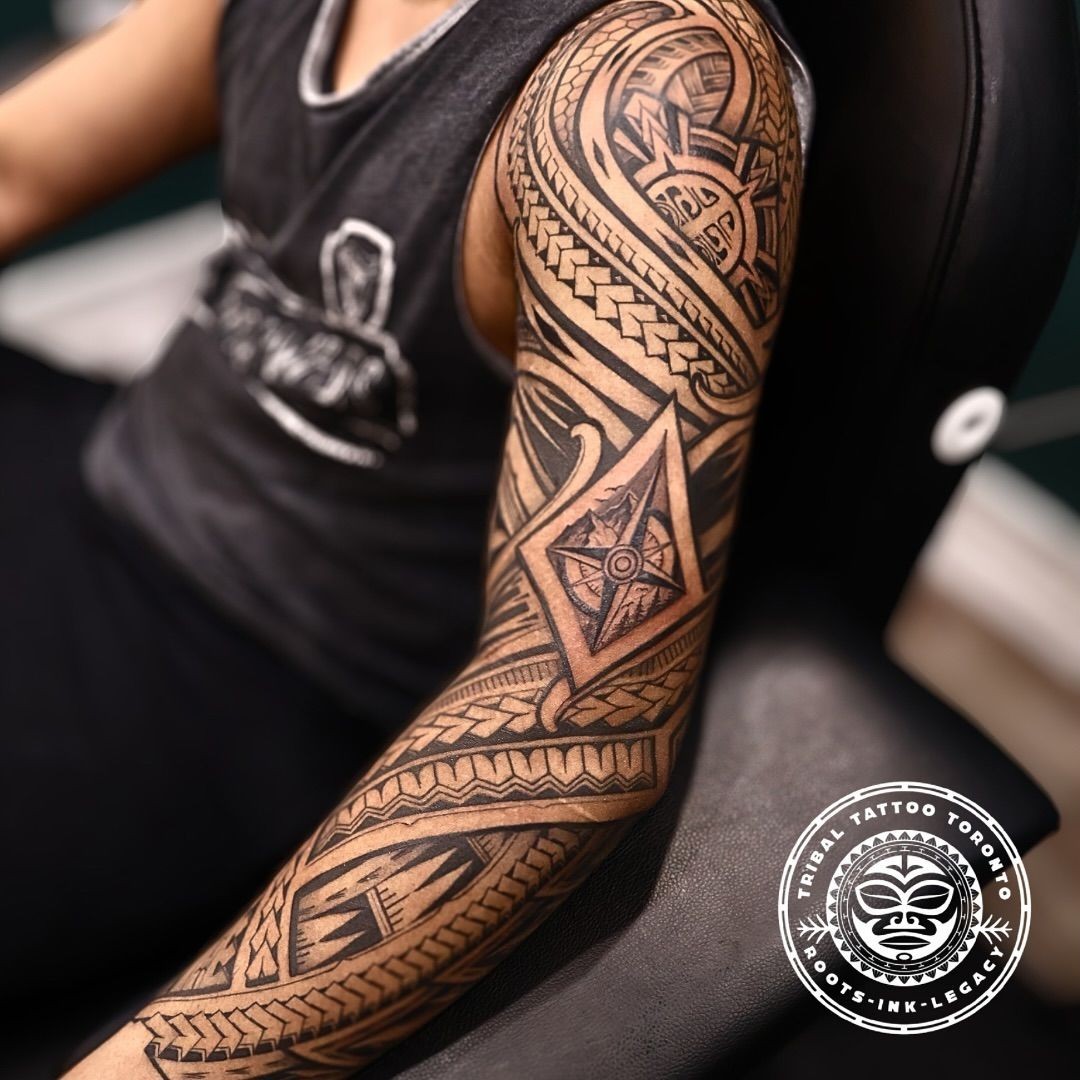 Polynesian tribal sleeve in Toronto studio—bold black geometric patterns